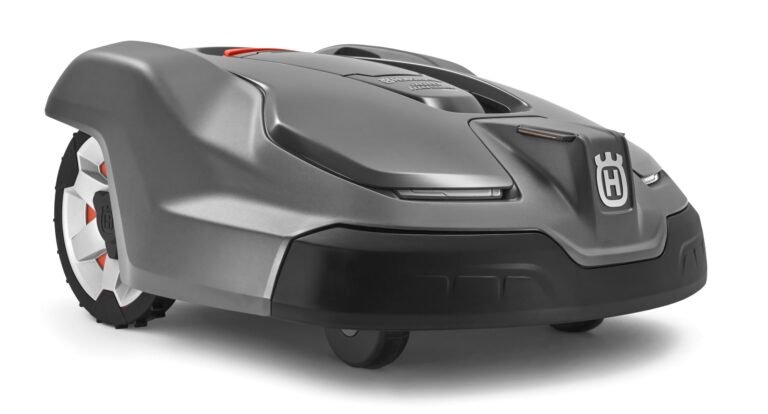 Gray Husqvarna robotic lawnmower with orange accents, on a white background