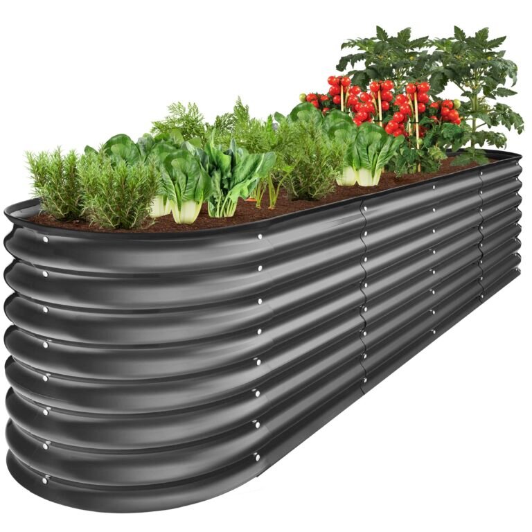 Raised metal garden bed with various vegetables and tomatoes growing inside