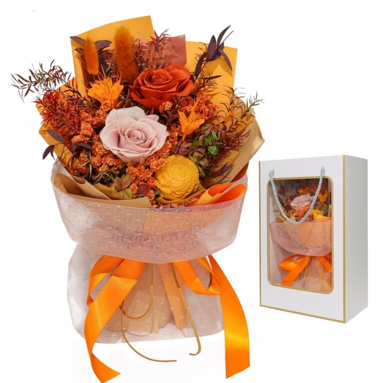 Bouquet of orange and pink flowers with a gift box